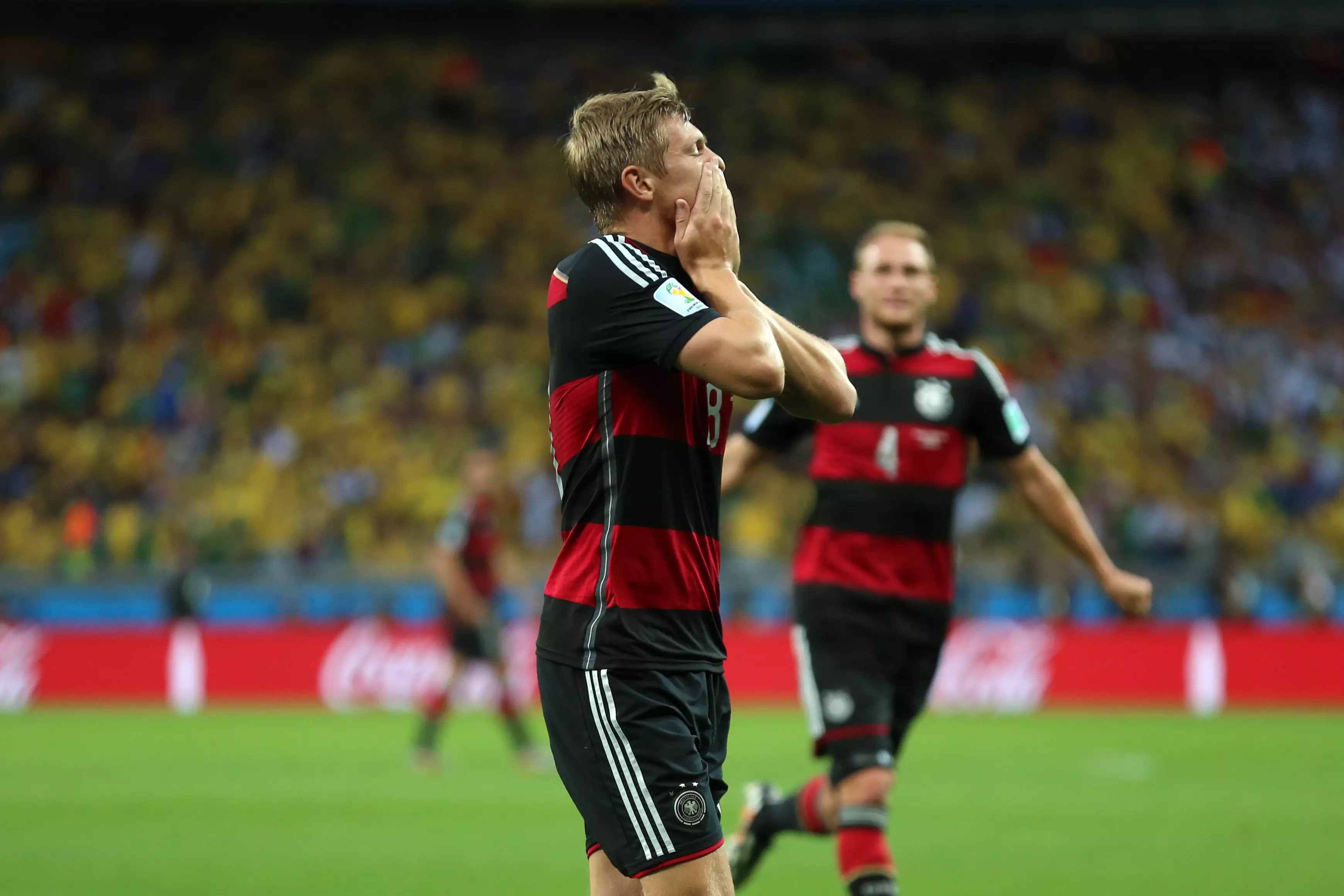 Toni Kroos celebrates Germany's third of the rout. Image: PA Images