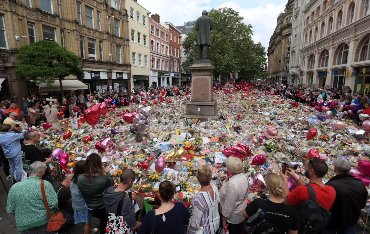 Flowers and tributes left in St Ann's Square.