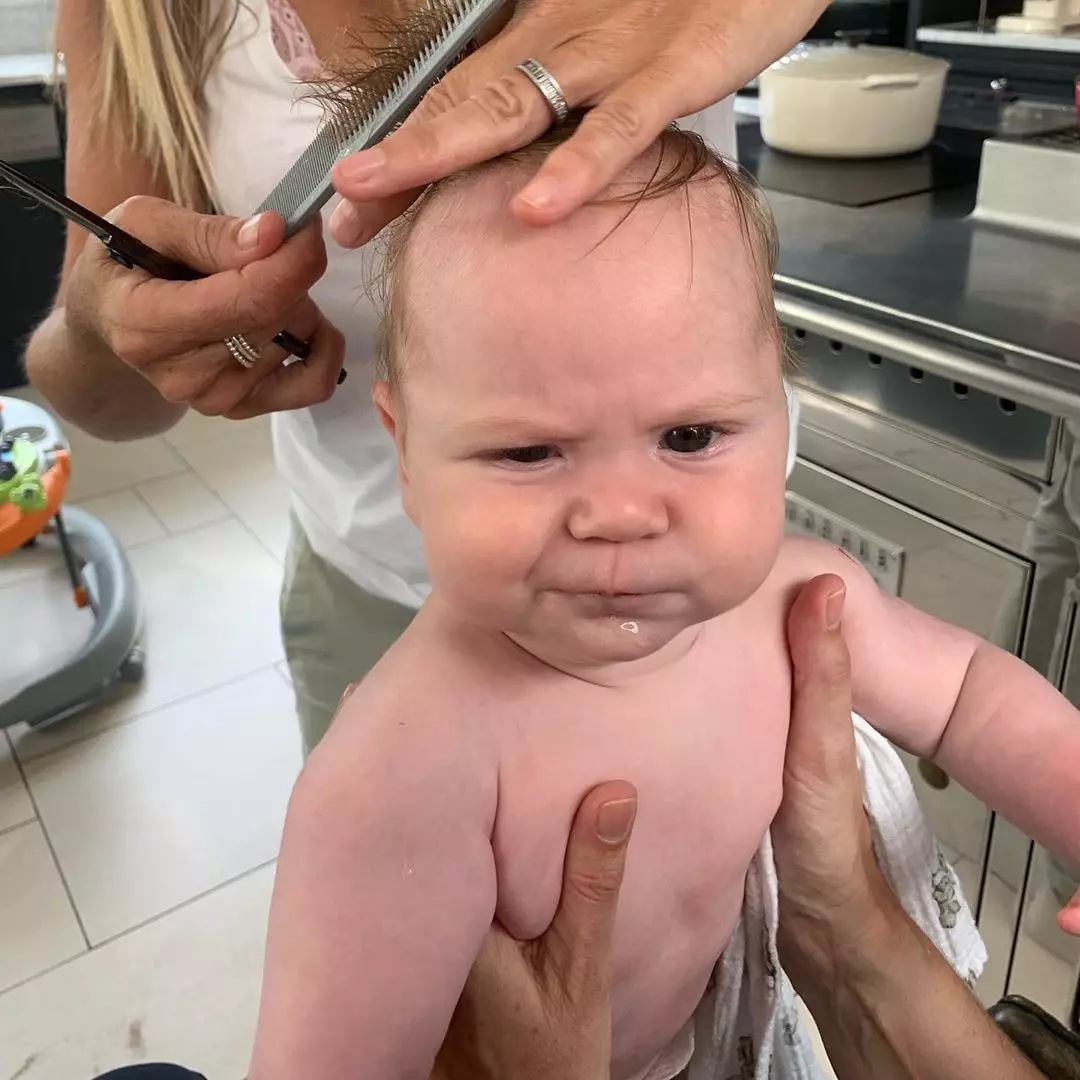 Oscar Ramsay has just had his first haircut - and he doesn't look happy about it.
