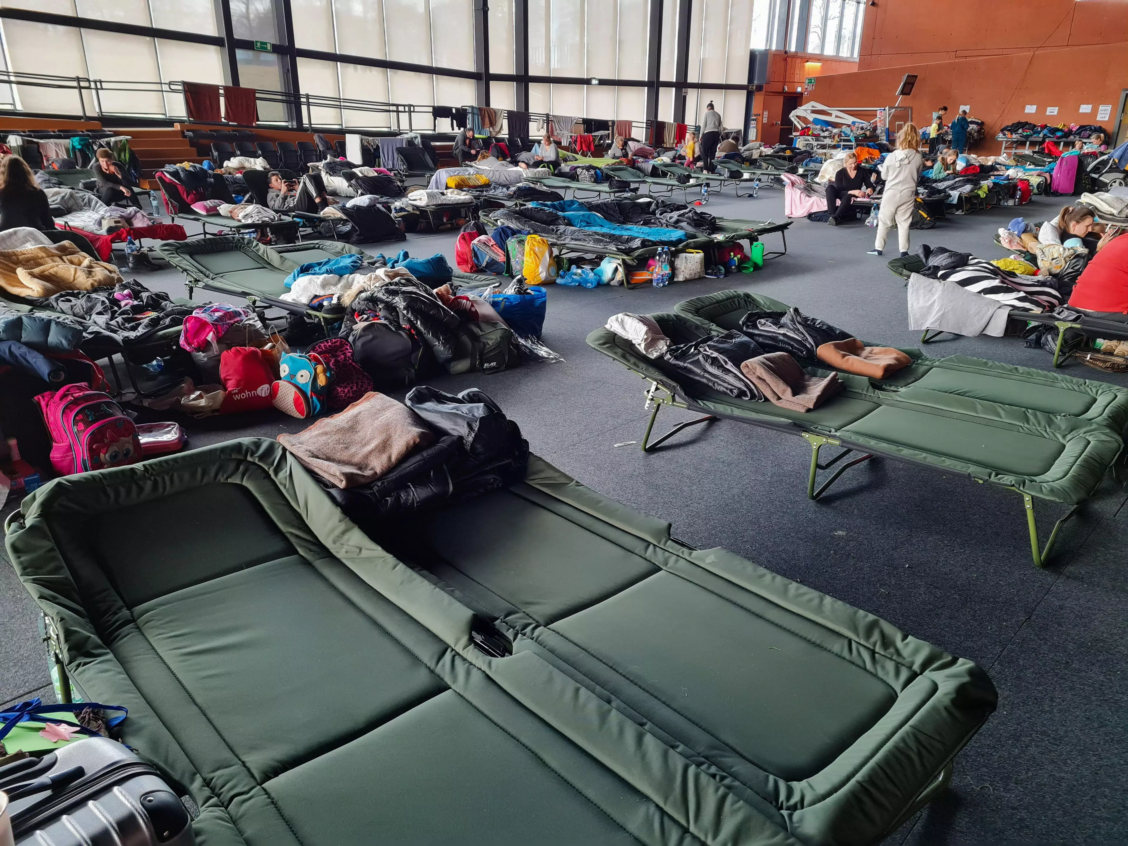 Many Ukrainians have fled with few belongings and are housed in camps such as this in Poland.