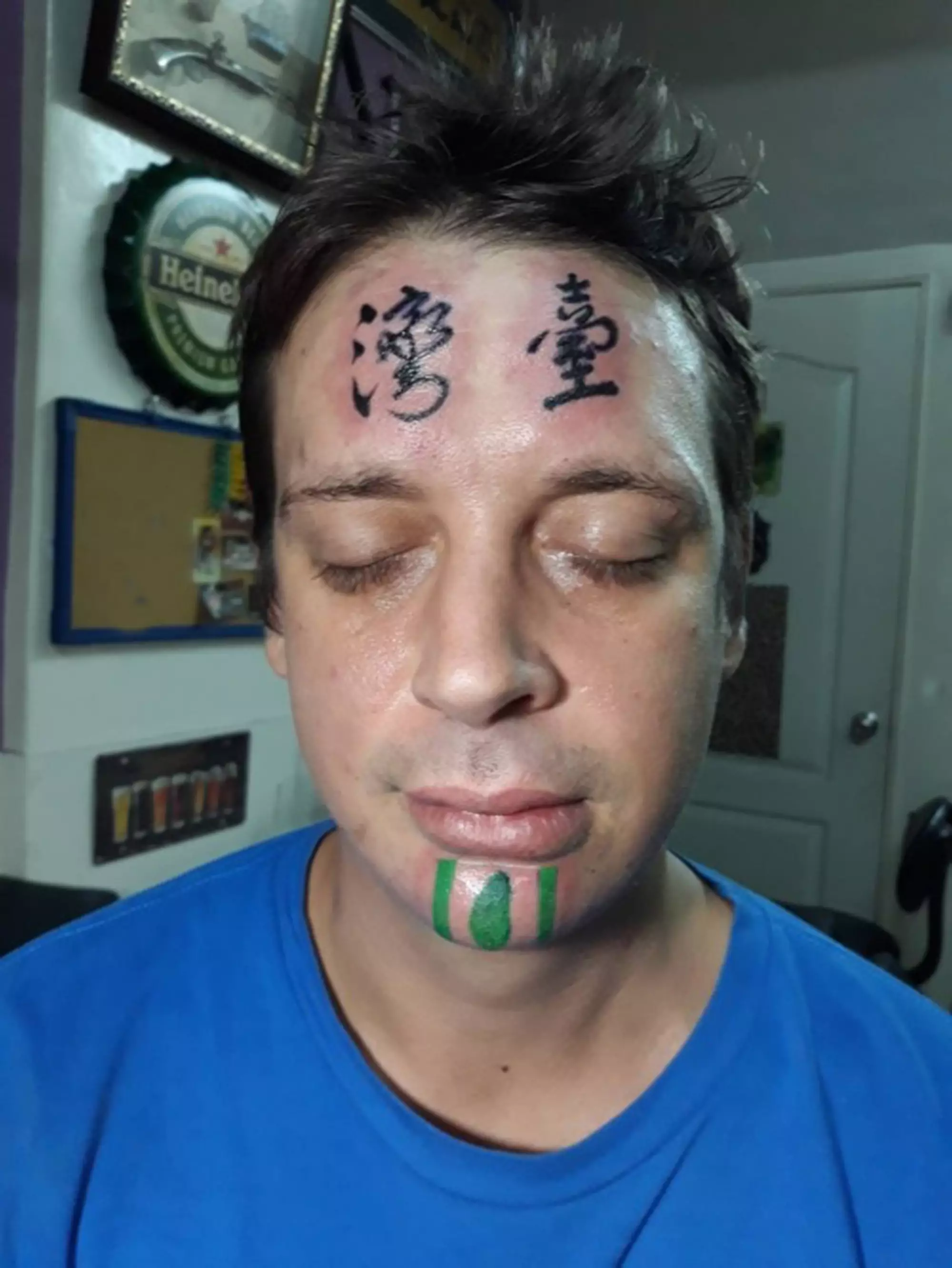 Man with face tattoo