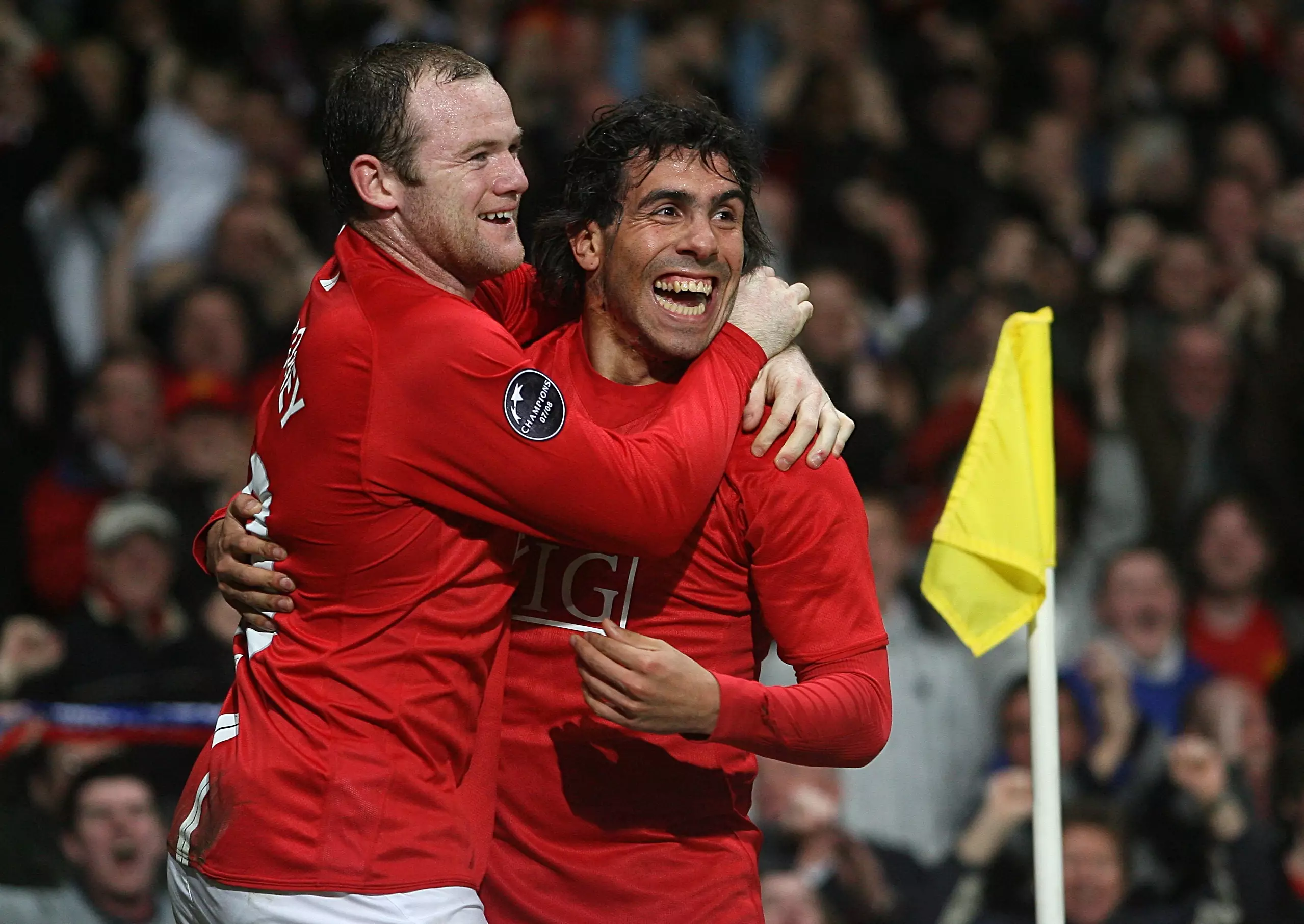 Rooney celebrates with Tevez. Image: PA