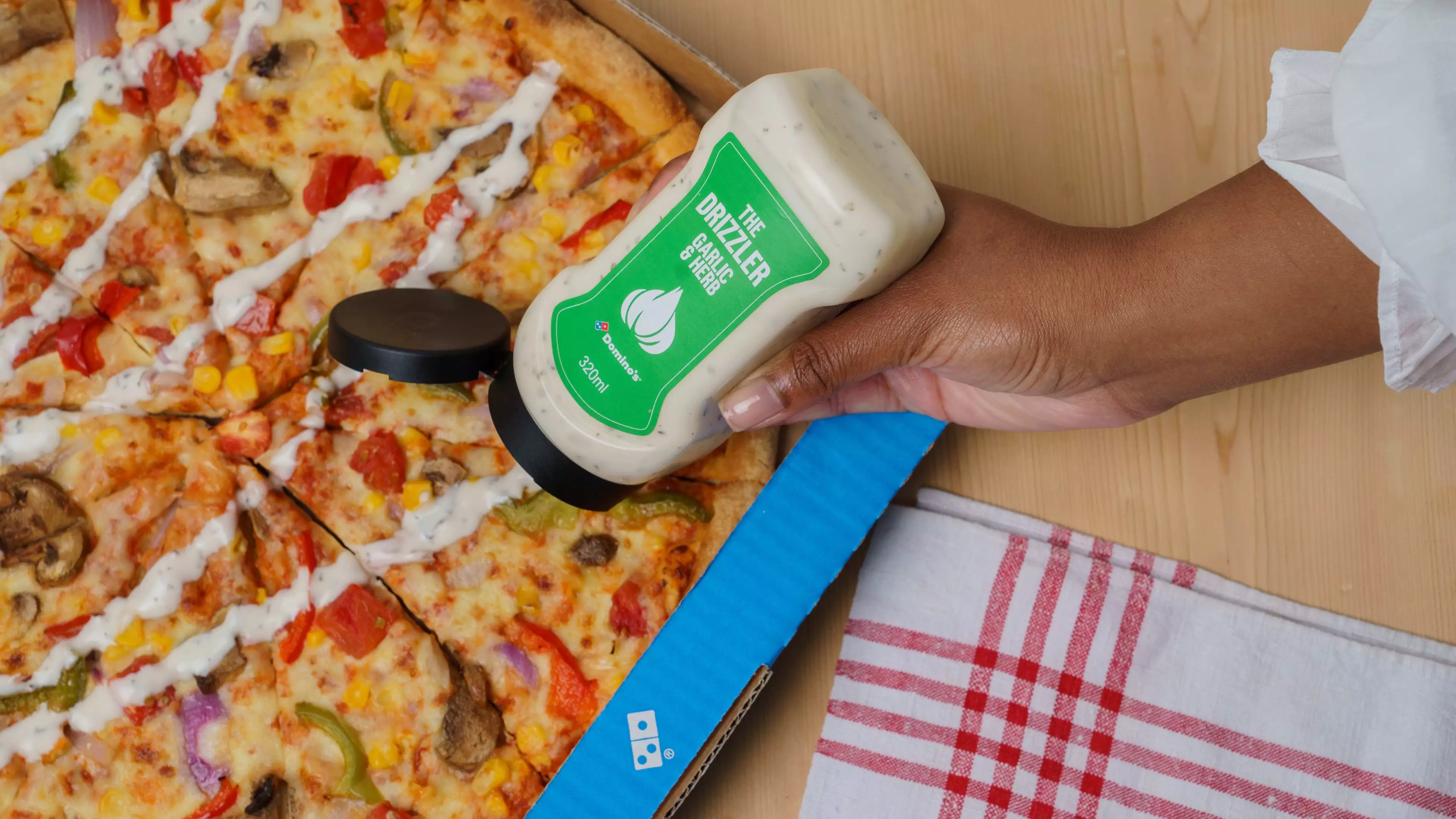 Domino's Unveils Limited Edition Garlic & Herb Drizzler Bottles 