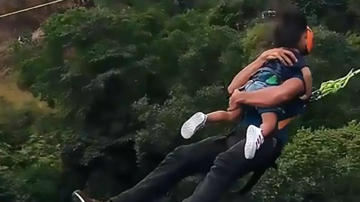 Man Does 60-Metre Bungee Jump While Holding Tiny Daughter
