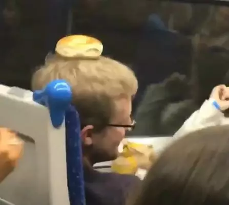 Train Passengers Go Sick After Someone Puts A Bagel On A Man's Head