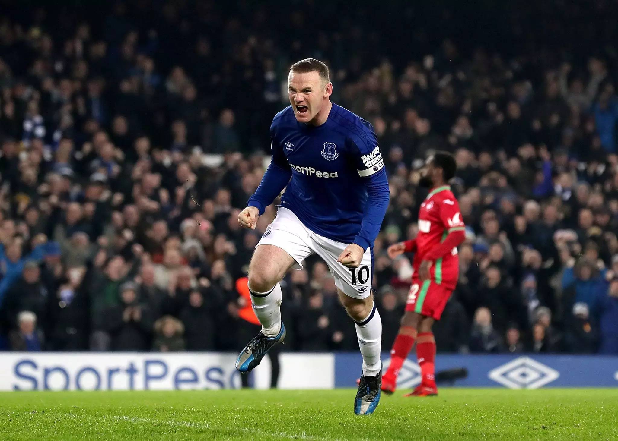 Rooney celebrates scoring a goal. Image: PA