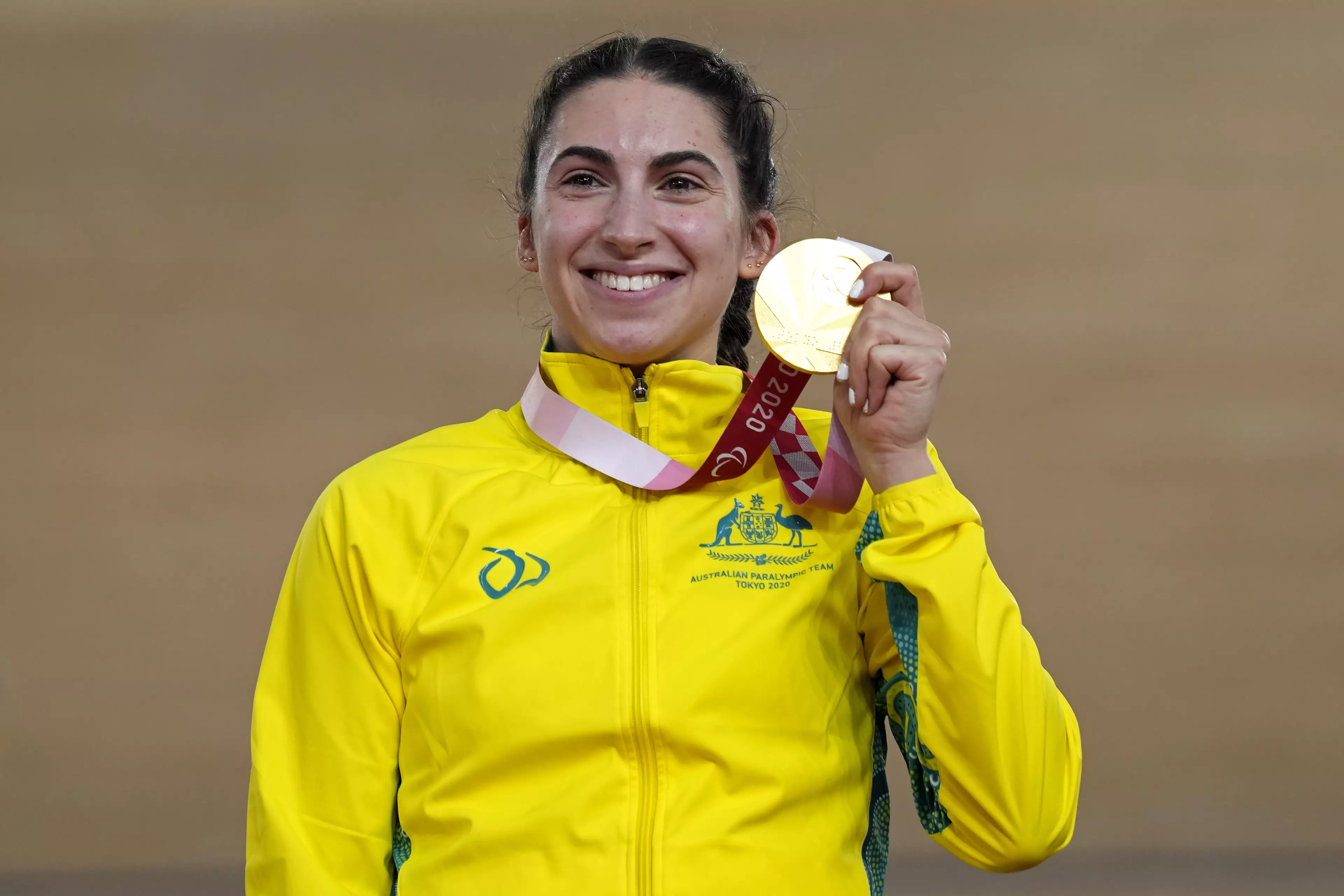 Australia's Paige Greco holds her gold medal after winning the Cycling Track Women's C1-3 3000m Individual Pursuit.