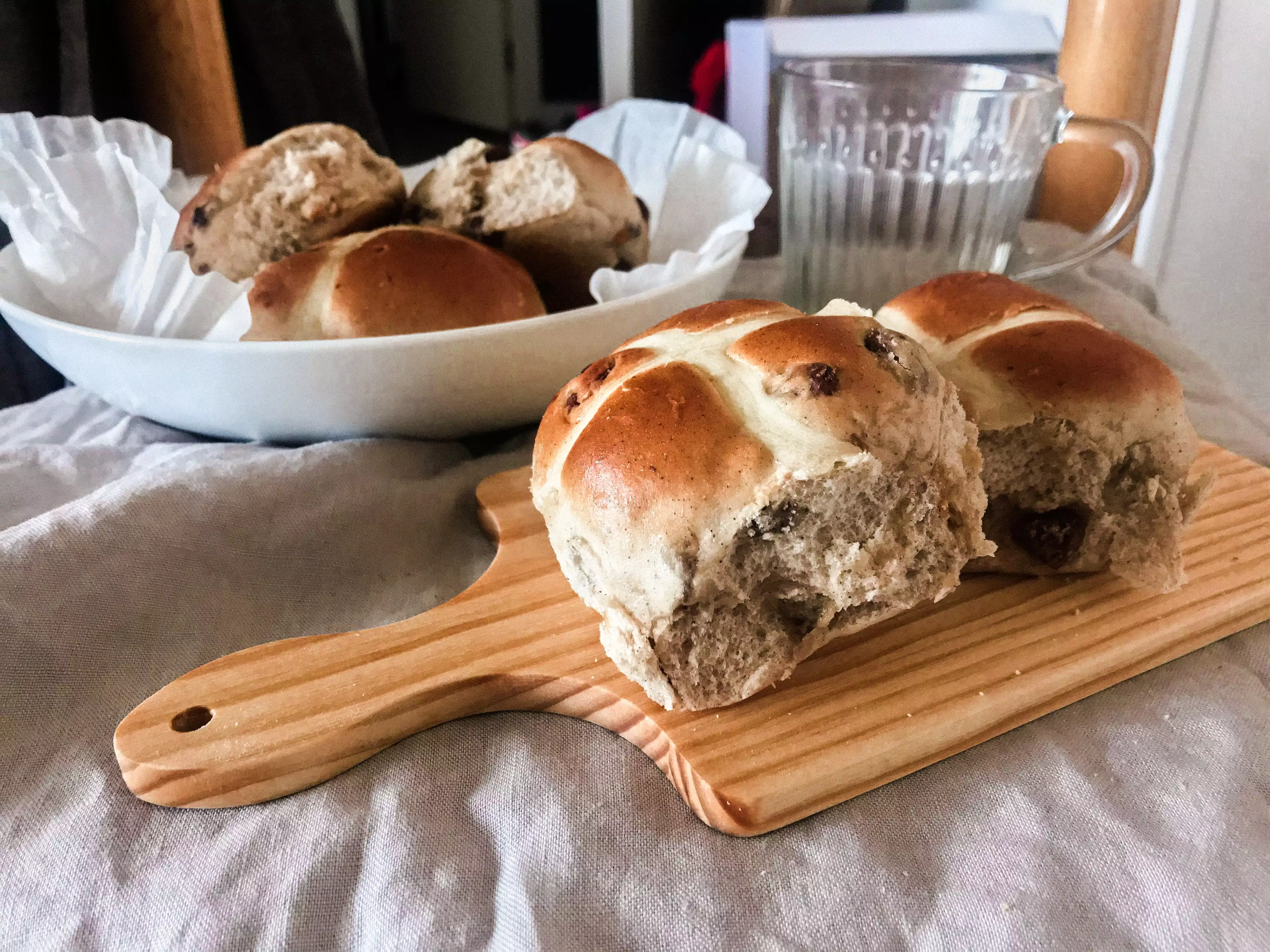 Hot cross buns are typically eaten on Good Friday and are made with spices and currants (