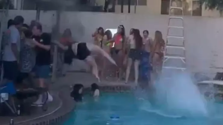 Woman's Attempted Rooftop Jump Into Pool Goes Badly Wrong