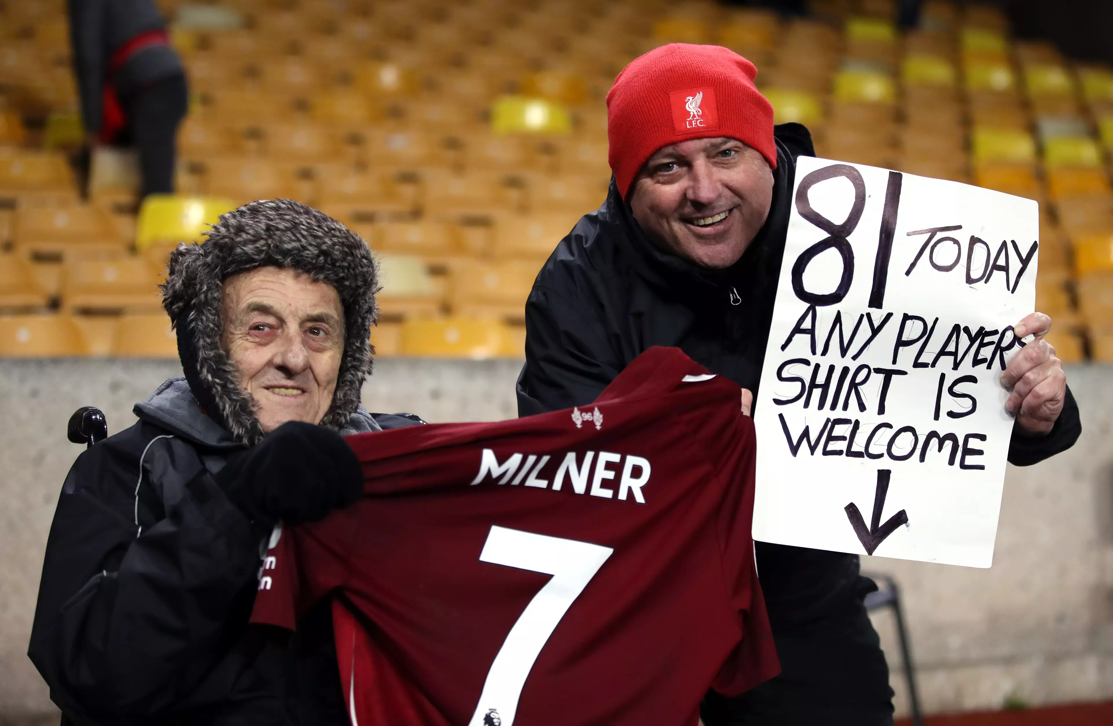 One fan tries to help get a Liverpool shirt. Image: PA Images