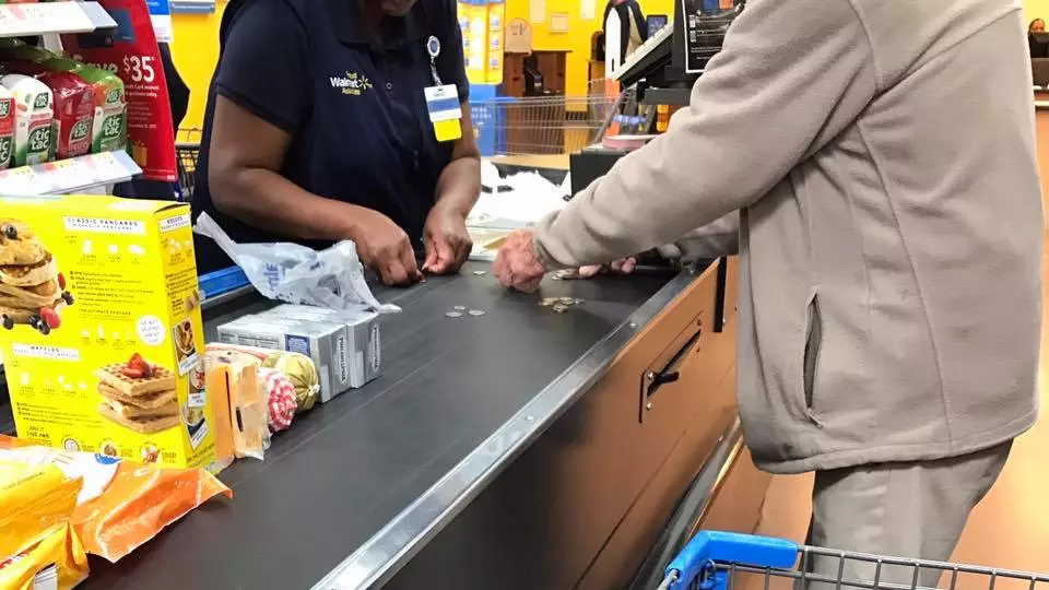 Walmart Cashier's Kind Deed Of Helping Old Man Count Change Goes Viral