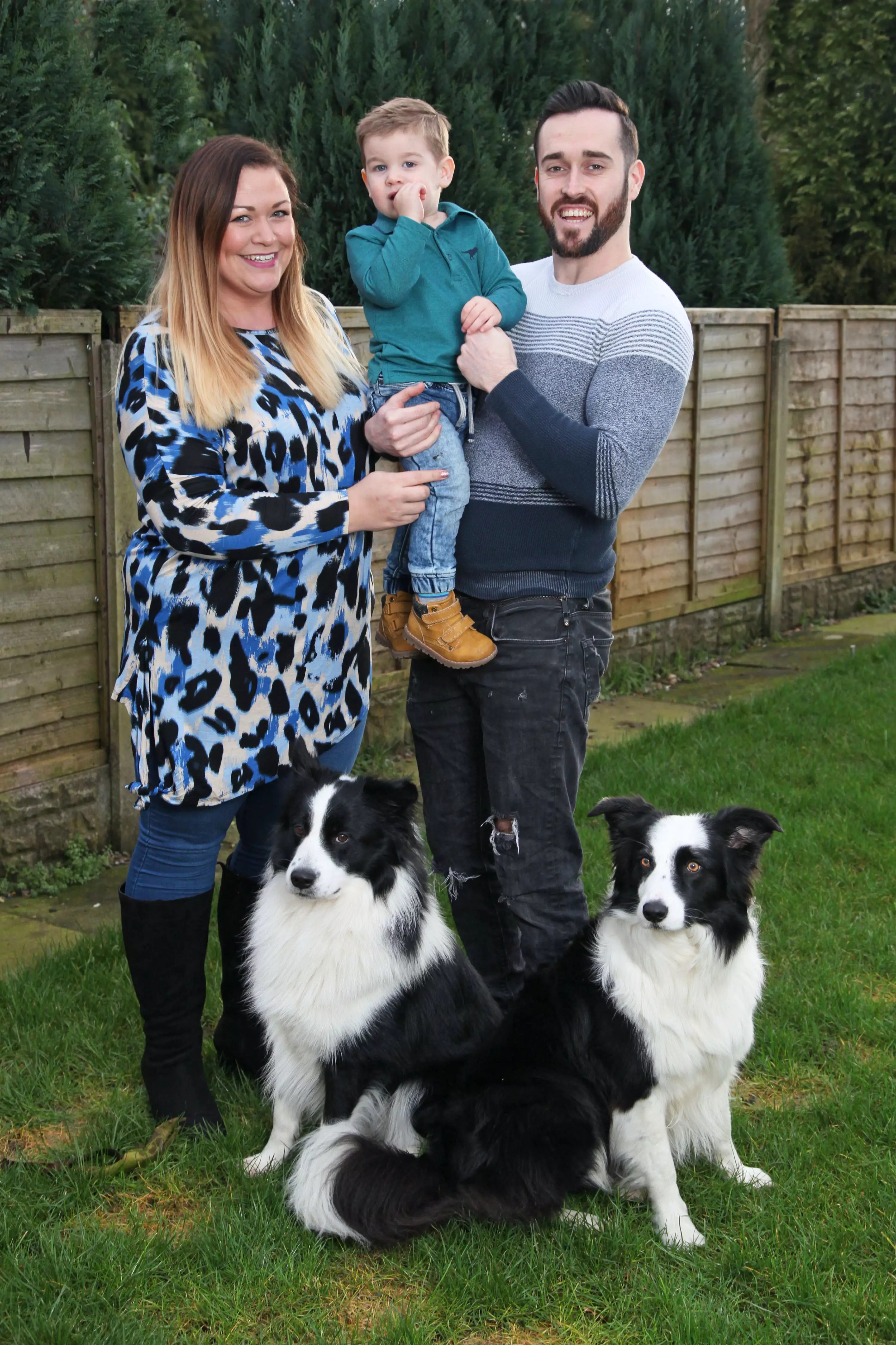 Jenson Webster with parents Laura Webster, 29, and Tom Webster, 30, and dogs Fenn and Nova.