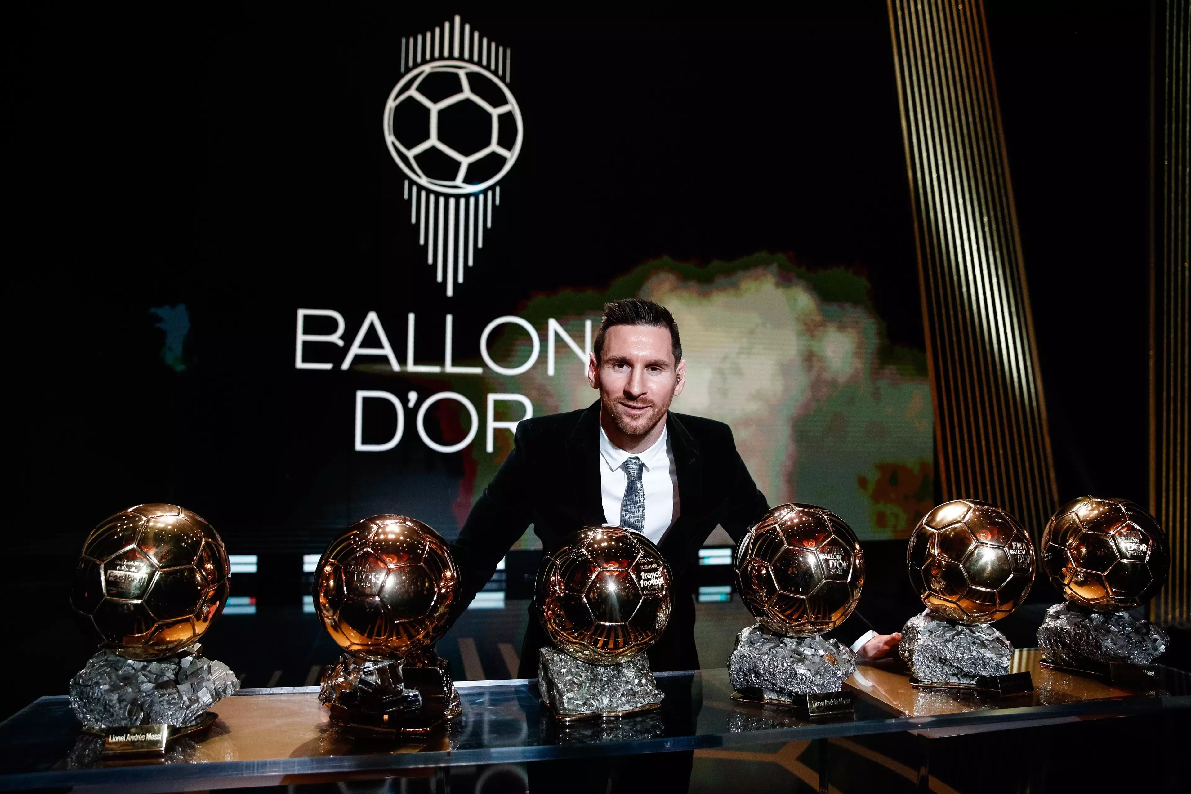 Messi with his six Ballon d'Ors. Image: PA Images