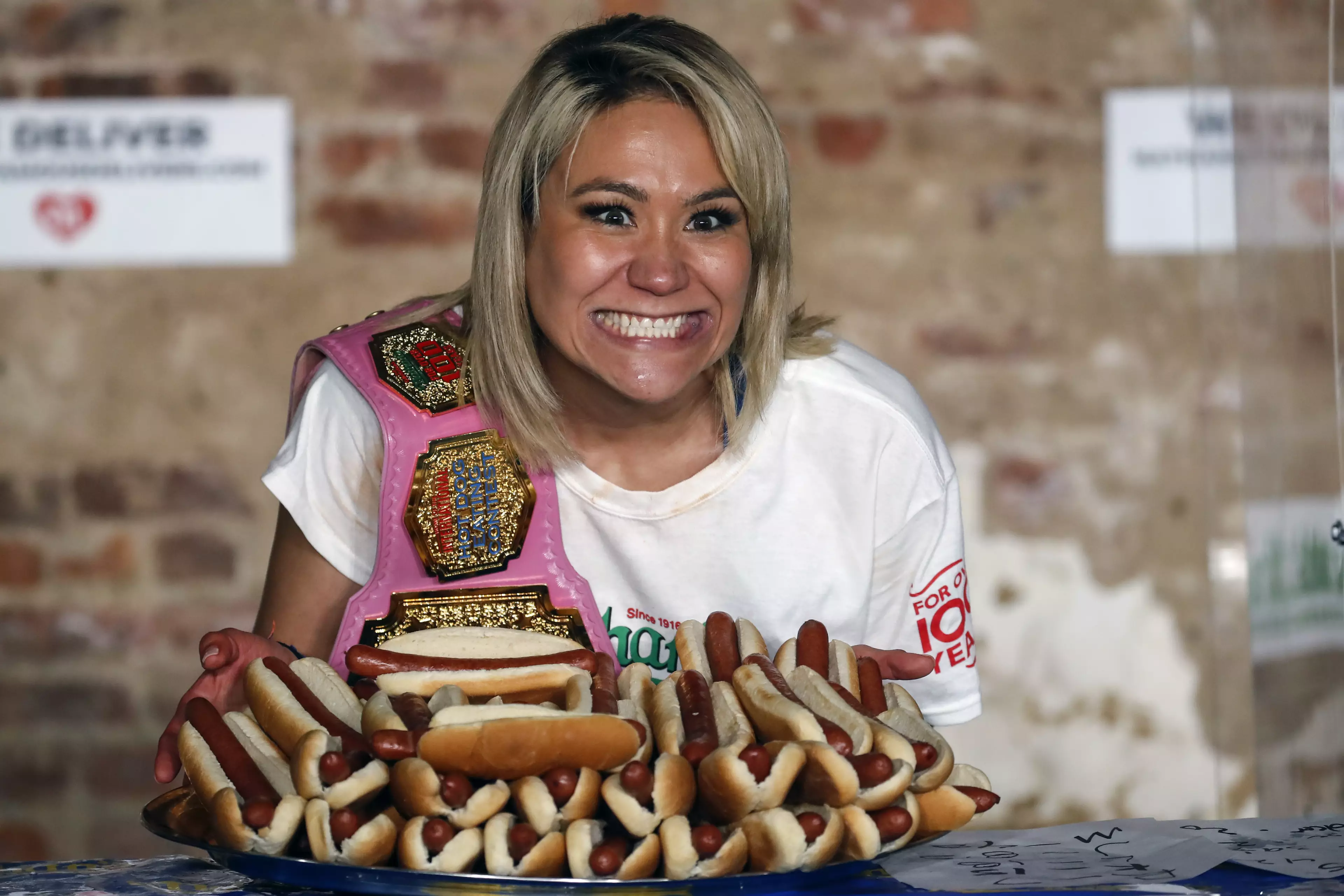 Miki Sudo won the women's title, consuming 48.5 hot dogs in 10 minutes.