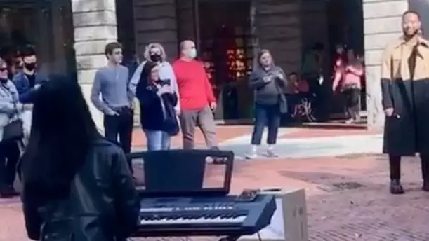 John Legend Watches On As Busker Performs One Of His Songs