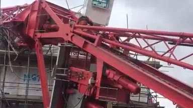 Crane Collapses On House, Trapping People Inside 