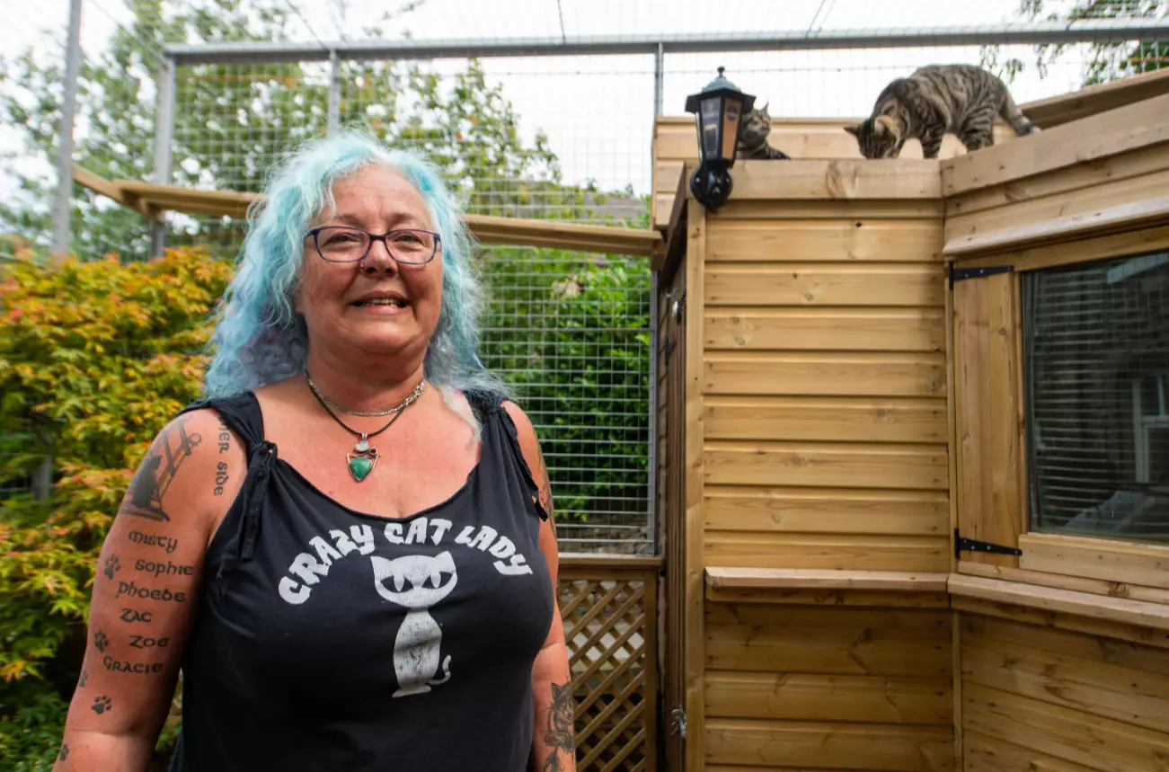 Sue with some of her cats.