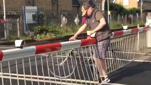 Impatient Cyclist Narrowly Avoids Getting Run Over By A Train