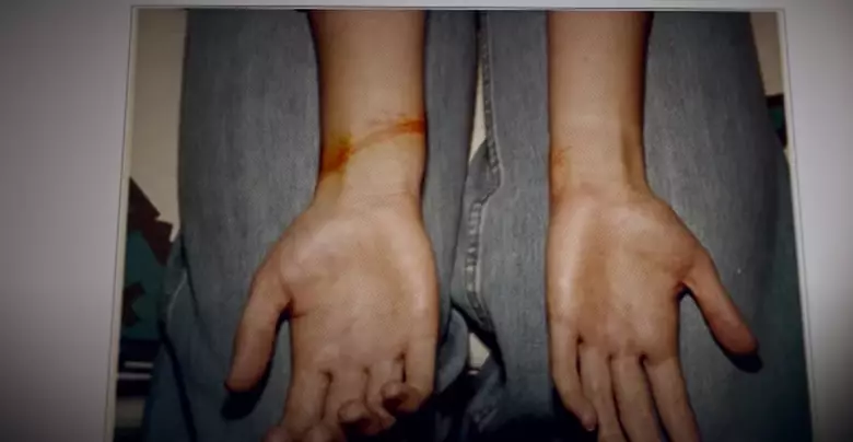 Harrowing footage shows photos of victims wrists after being tied up (