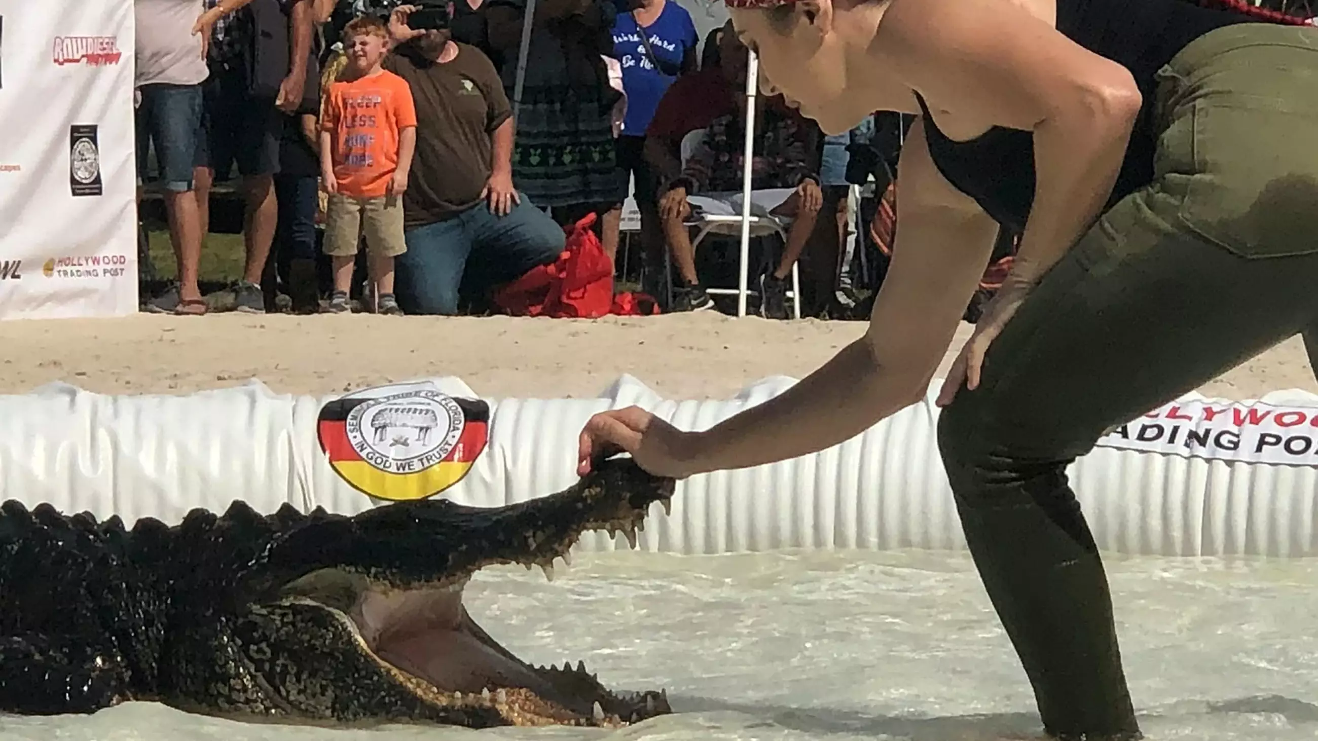 Woman Sticks Her Head Inside An Alligator's Mouth At Wrestling Competition