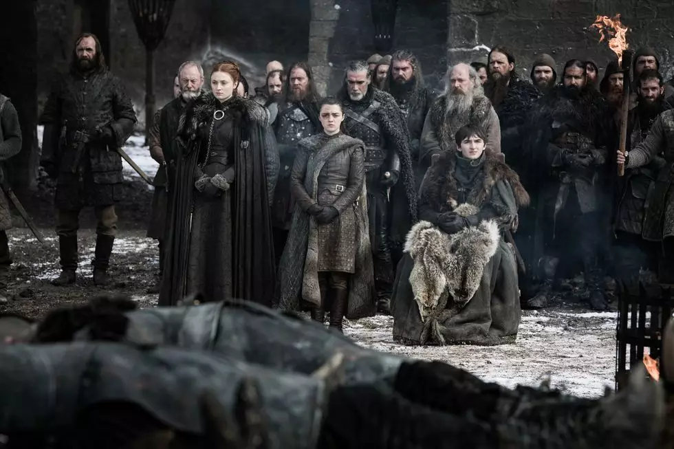 The Hound, Davos, Sansa, Arya and Bran also watch on solemnly.