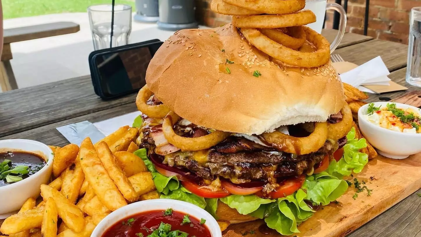 Man Becomes First To Ever Complete Australian Pub's 5kg Burger Challenge