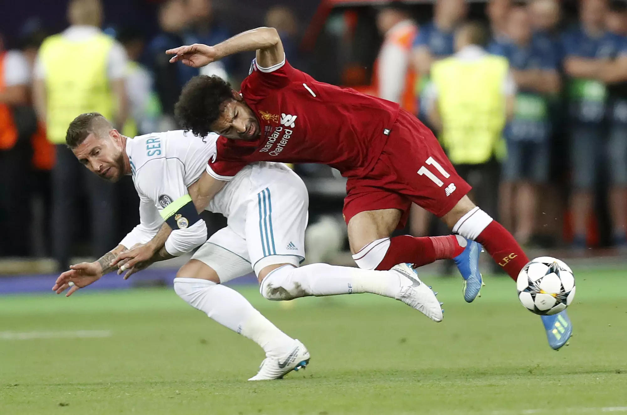 Ramos tangles with Salah. Image: PA