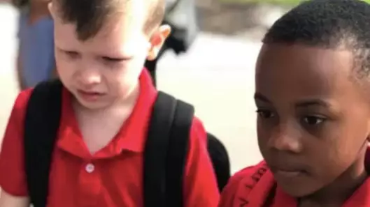 Little Boy Holds Autistic Boy's Hand To Calm Him Down On First Day Of School