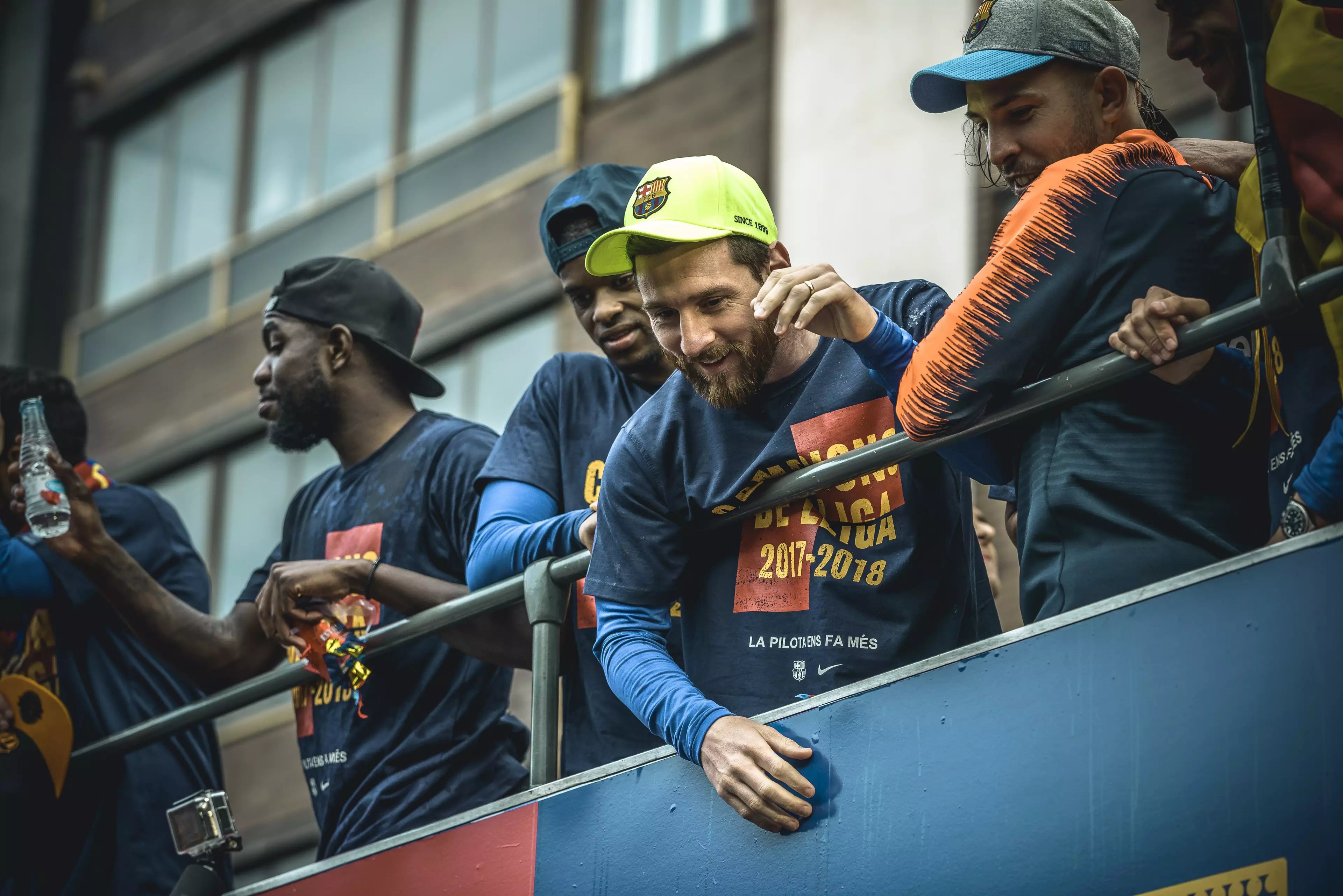 Messi greets fans during the clubs open top bus victory parade. Image: PA