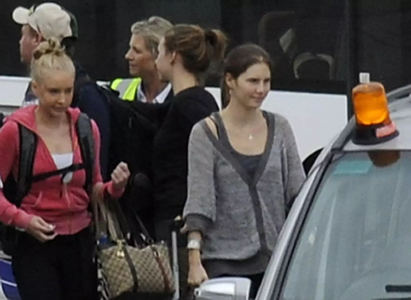 Amanda Knox (right) at Heathrow Airport after she was acquitted of the murder of British student Meredith Kercher.