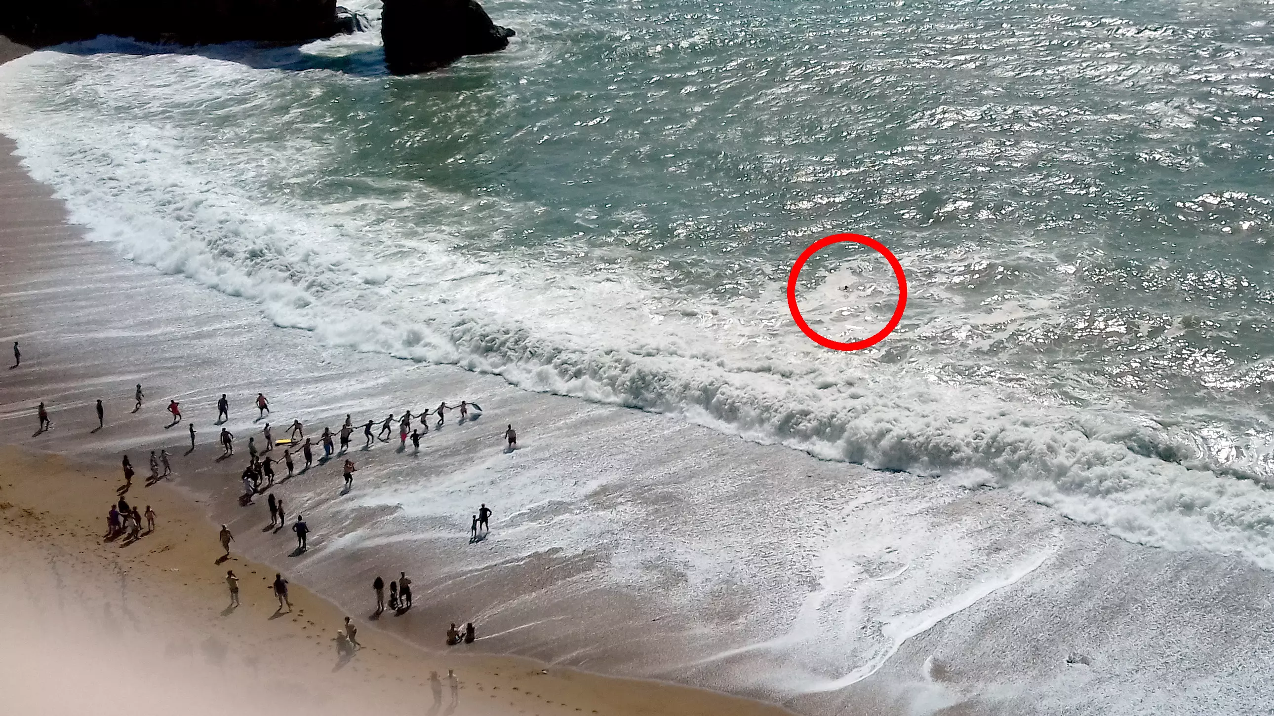Beachgoers Link Arms And Form Incredible Human Chain To Save Man