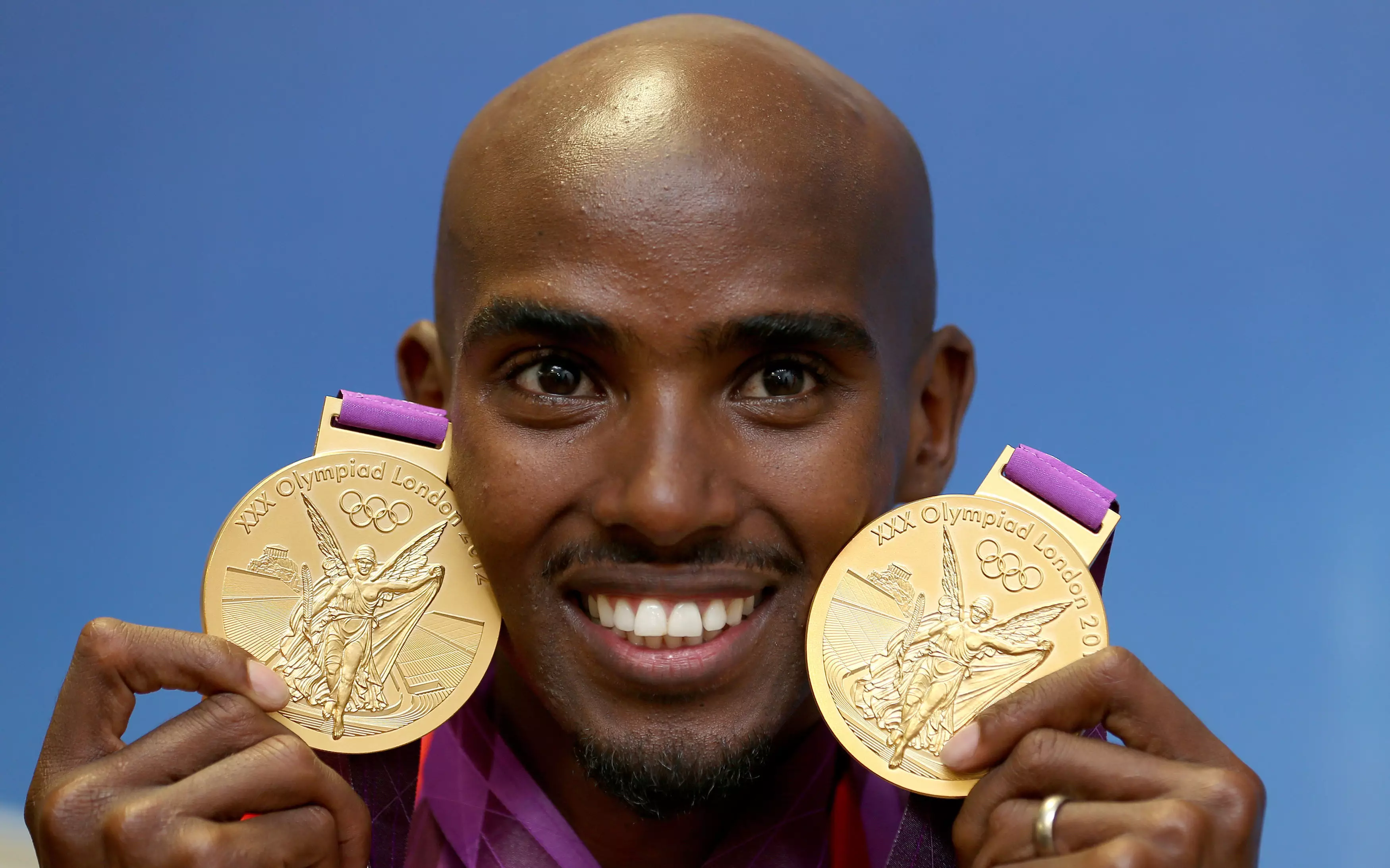 Mo Farah with gold medals