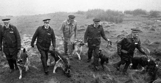 Photo dates 20/11/1986 of police using specially trained sniffer dogs on Saddleworth Moor, near Oldham, to search for Keith Bennett.