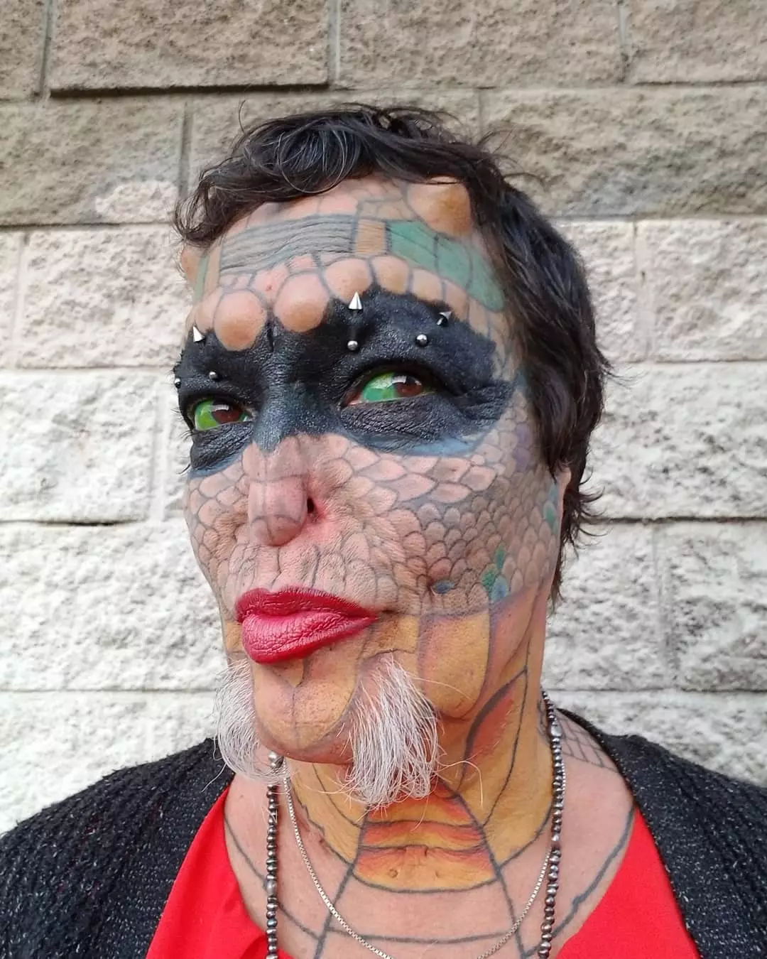 They have so far spent £61,000 on turning themselves into a 'Human Dragon'.