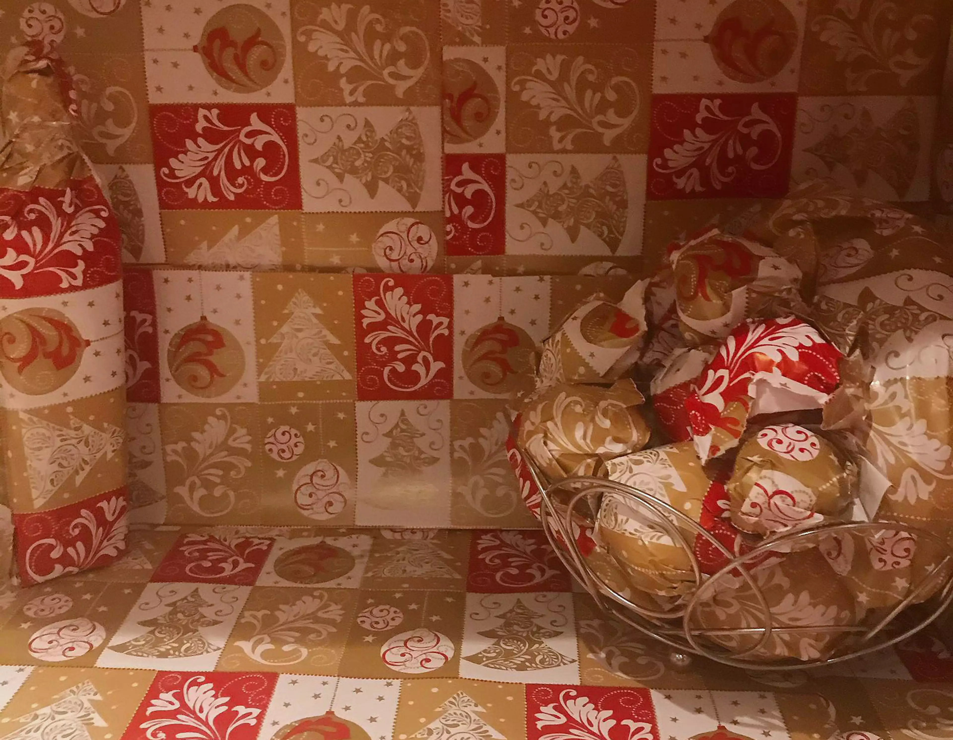 They spent two hours wrapping the contents of their kitchen in Christmas paper. (
