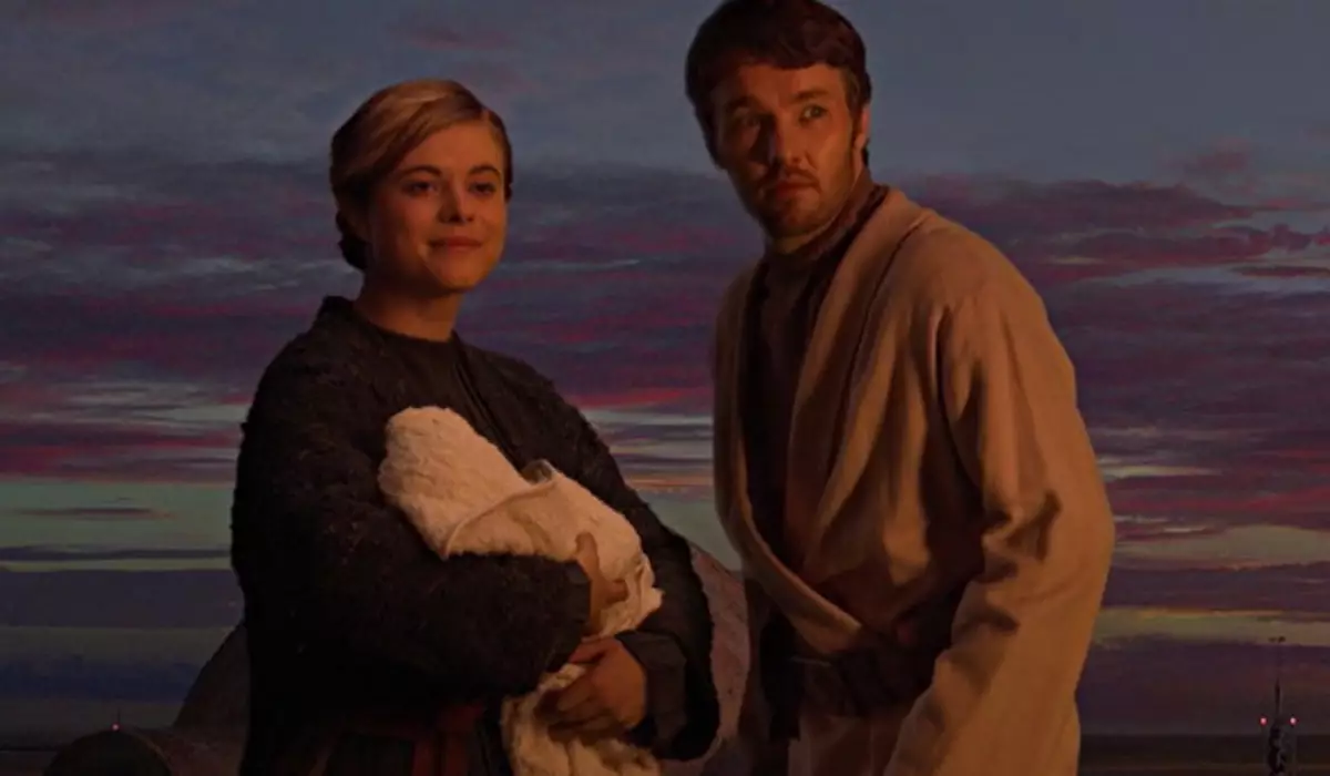 Beru and Owen holding the infant Luke Skywalker in 'Star Wars: Episode III Revenge of the Sith' /