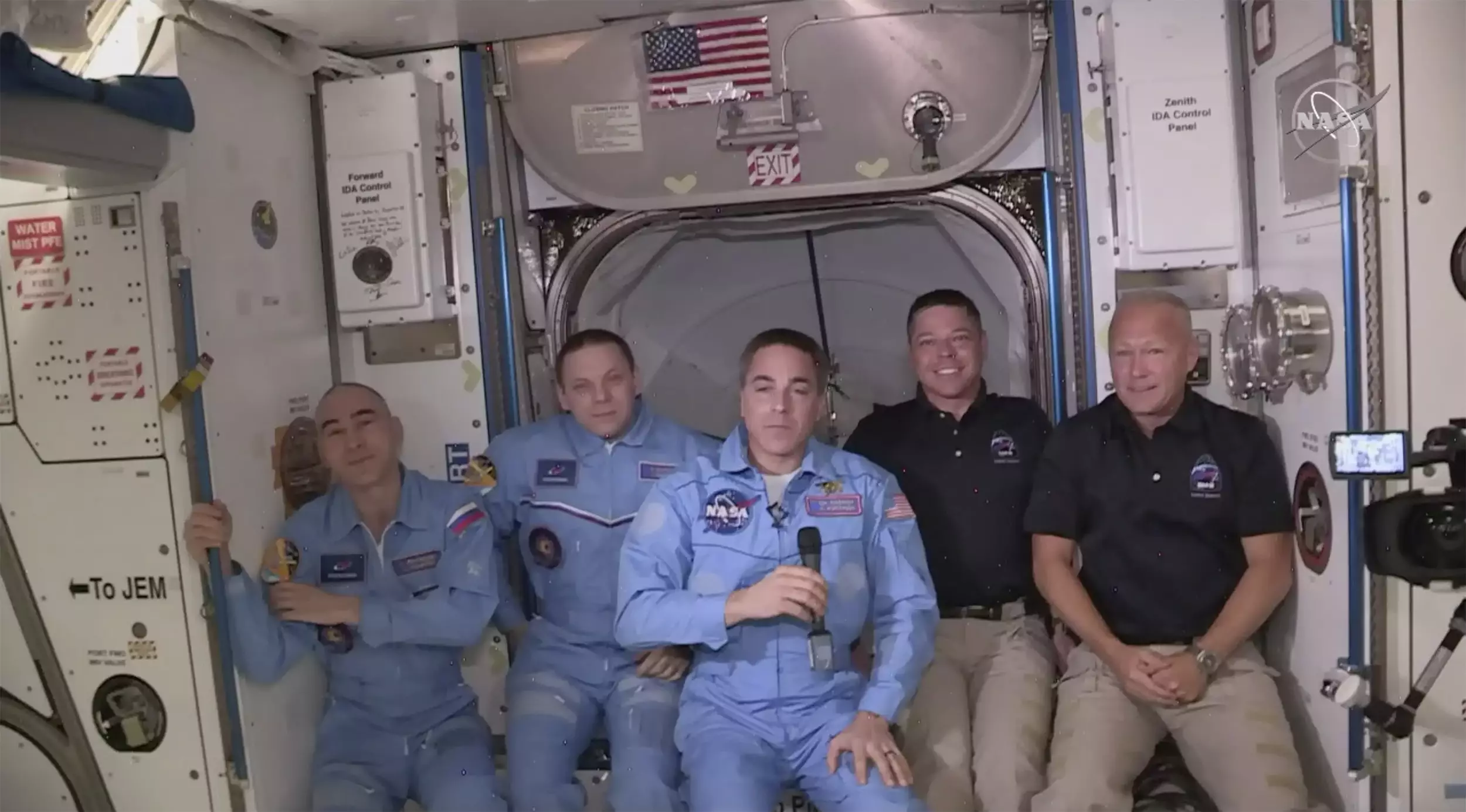 Bob Behnken and Doug Hurley, far right, joining the the crew at the International Space Station.