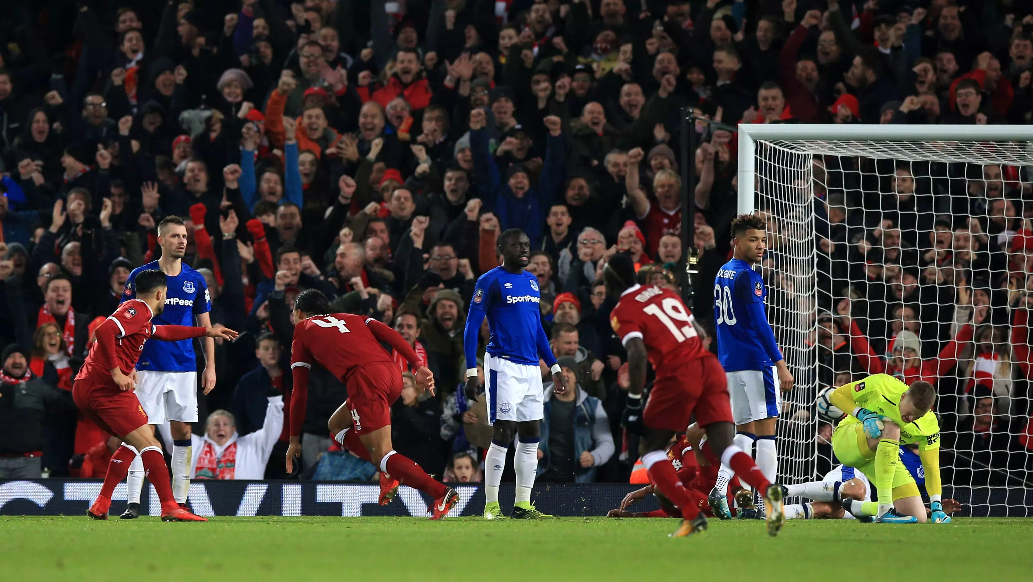 van Dijk wheels away in celebration after scoring against Everton. Image: PA