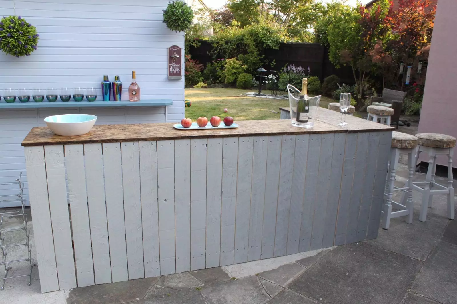 Craig created an incredible outdoor bar himself, using pallets and reused wood (