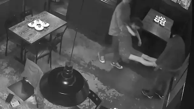 CCTV shows a woman being carried out of the venue.