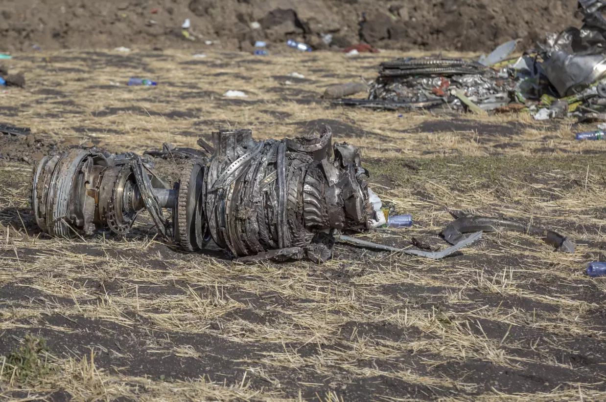Aeroplane parts on the ground at the scene of an Ethiopian Airlines flight crash.