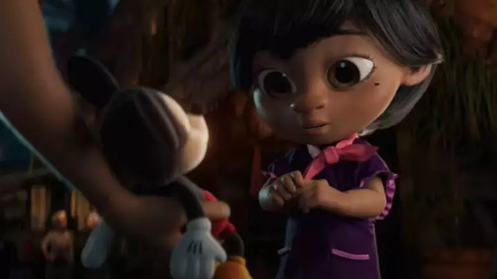 In the cute advert, we see Lola being given a Mickey Mouse toy by her father (