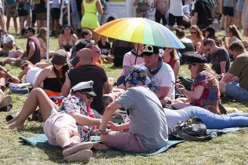 Festival goers were shading from the sun during the heatwave that struck during Glastonbury Festival.