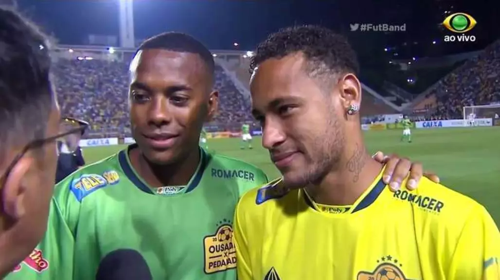 Neymar and Robinho, the two captains in the charity game, chat to reporters following the game. (Image