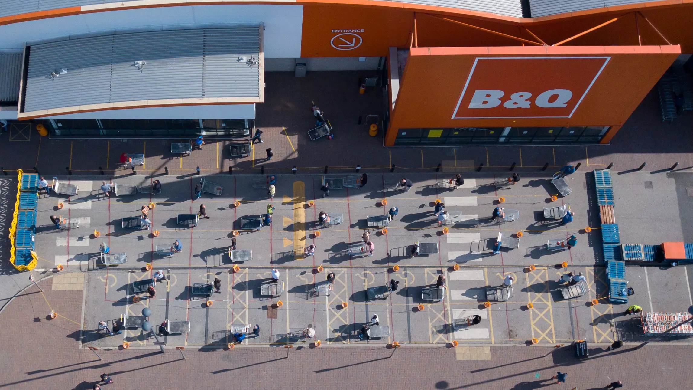 Aerial Photos Show Shoppers Queuing Up Outside B&Q After It Reopens