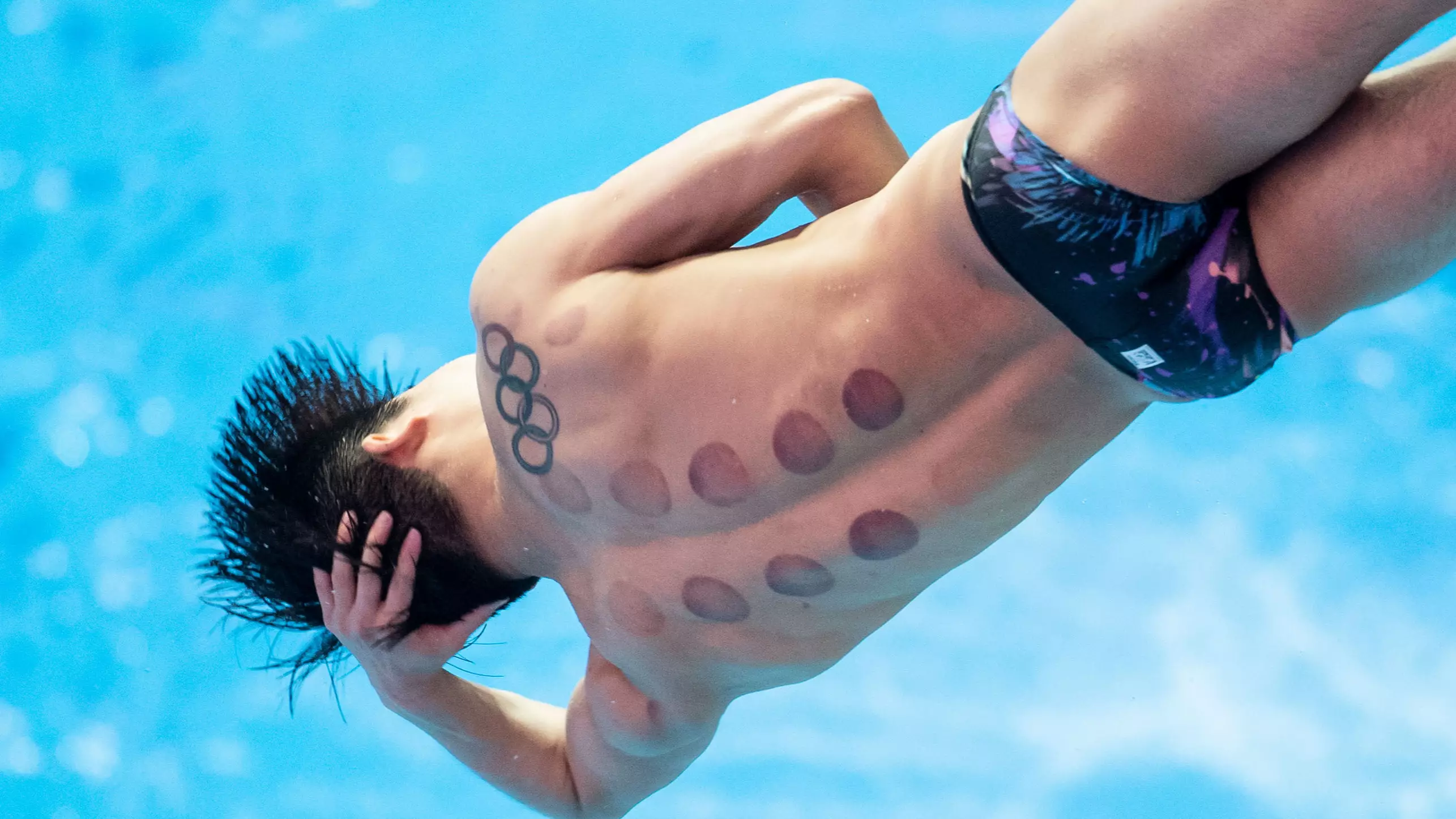 Tokyo 2020: Why Do Swimmers Have Dark Circles On Their Backs?