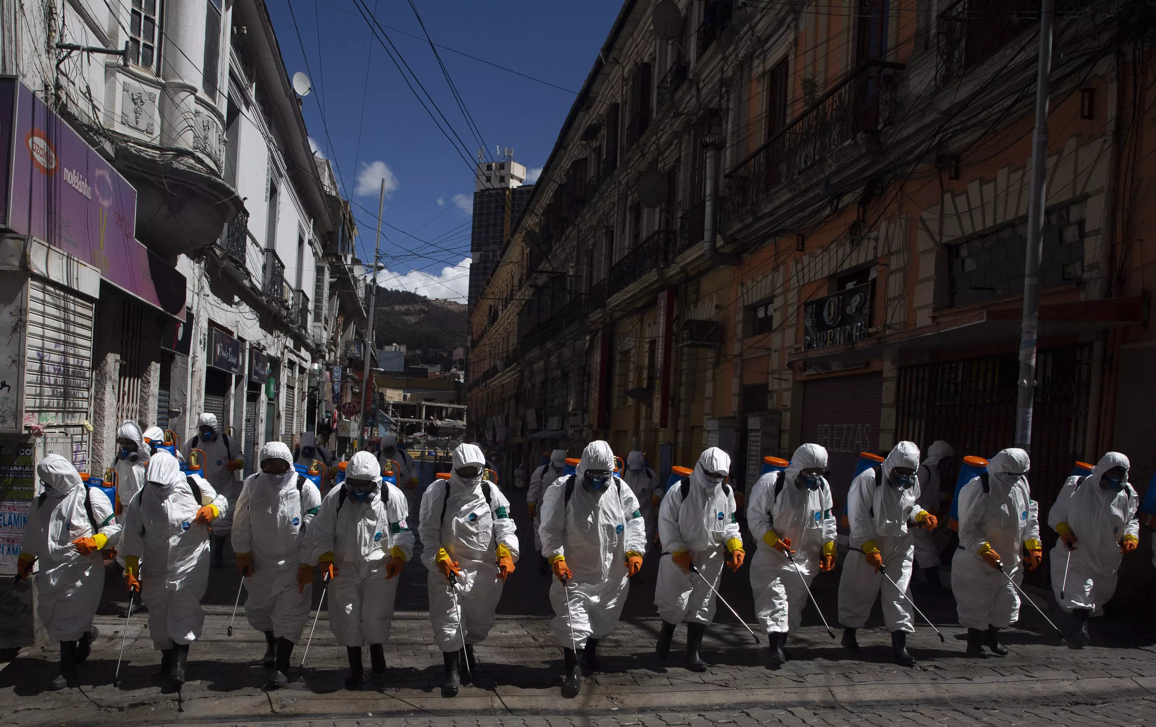 Workers in Bolivia trying to decontaminate the streets of Covid-19.