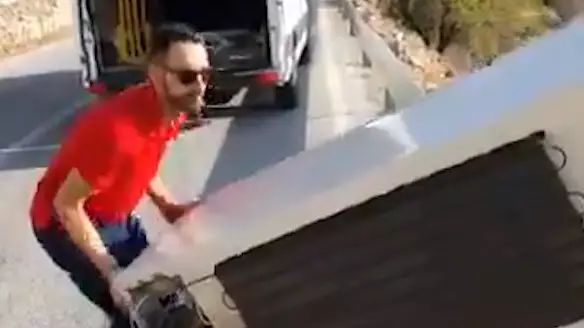 ​Police Force Man To Push Fridge Back Up Cliff After He Pushed It Off