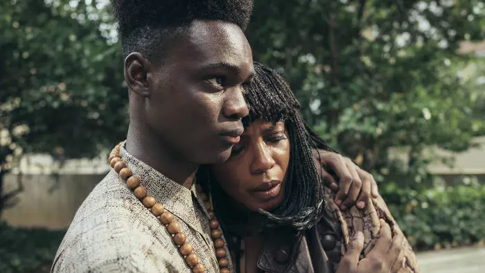 Ethan Herisse and Aunjanue Ellis as Yusef Salaam and his mother.
