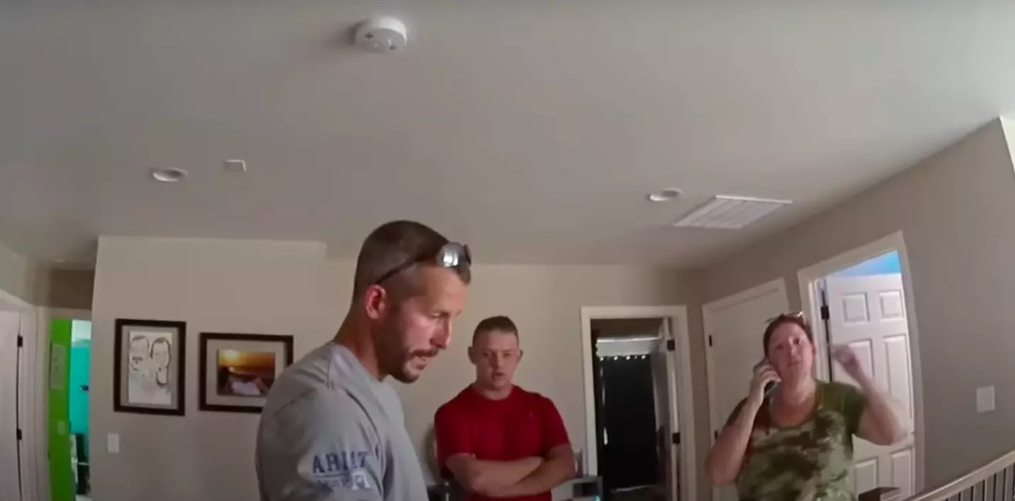 The clip shows Chris at home with police officers along with Shanann's friend Nickole Atkinson and her son(